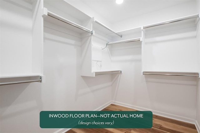 449 Vista Dr, Yukon, OK 73099 - walk in closet with wood finished floors