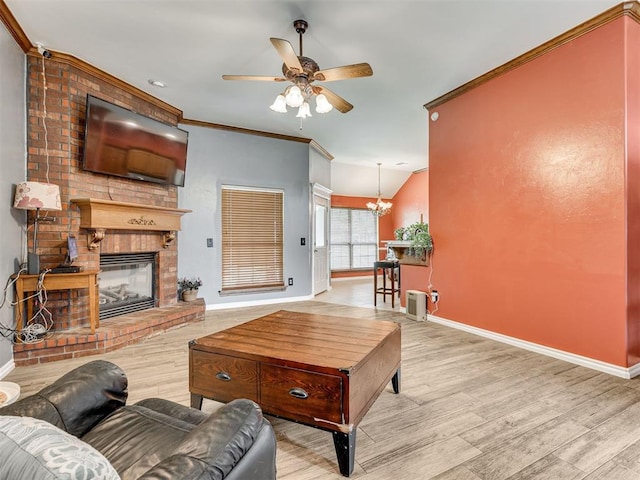 1801 Wagon Trail Blvd, Harrah, OK 73045 - living room featuring wood finished floors, a ceiling fan, a chandelier, a brick fireplace, and crown molding