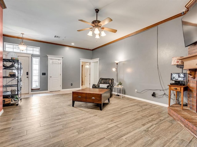 1801 Wagon Trail Blvd, Harrah, OK 73045 - living room featuring a ceiling fan, crown molding, and light wood-type flooring