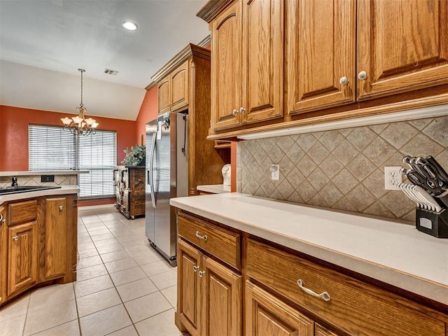 1801 Wagon Trail Blvd, Harrah, OK 73045 - kitchen featuring stainless steel fridge with ice dispenser, lofted ceiling, backsplash, brown cabinetry, and light tile patterned floors
