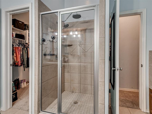 1801 Wagon Trail Blvd, Harrah, OK 73045 - full bathroom with a spacious closet, a shower stall, and tile patterned floors