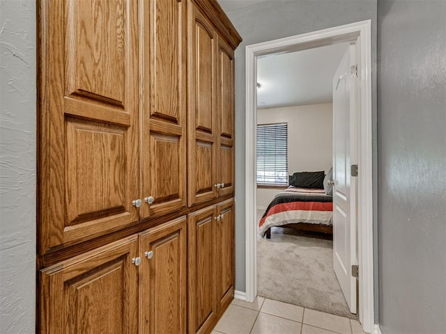 1801 Wagon Trail Blvd, Harrah, OK 73045 - corridor featuring light tile patterned floors and light carpet
