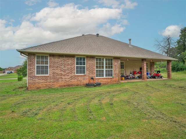 1801 Wagon Trail Blvd, Harrah, OK 73045 - back of property featuring a patio area, a lawn, brick siding, and a shingled roof