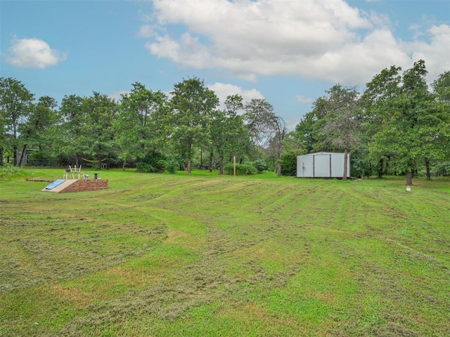 1801 Wagon Trail Blvd, Harrah, OK 73045 - view of green lawn with a storage unit