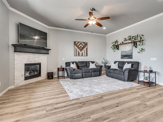 10824 NW 32nd Ter, Yukon, OK 73099 - living area featuring a ceiling fan, wood finished floors, crown molding, recessed lighting, and a fireplace