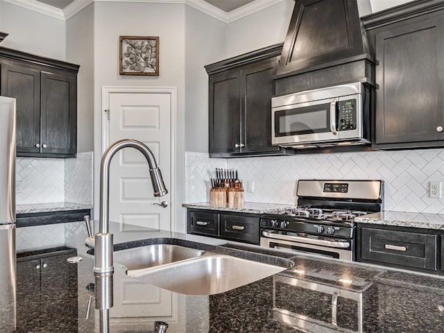 10824 NW 32nd Ter, Yukon, OK 73099 - kitchen featuring stainless steel appliances, crown molding, decorative backsplash, and dark stone countertops