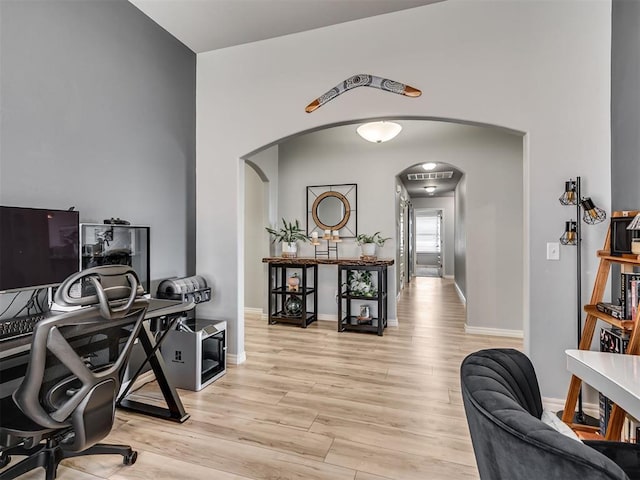 10824 NW 32nd Ter, Yukon, OK 73099 - office area featuring arched walkways and light wood-type flooring