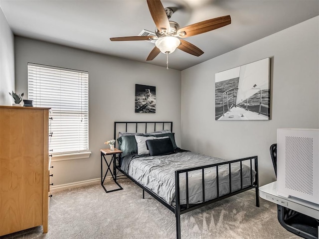 10824 NW 32nd Ter, Yukon, OK 73099 - carpeted bedroom featuring baseboards and a ceiling fan