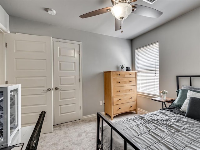 10824 NW 32nd Ter, Yukon, OK 73099 - bedroom featuring light carpet, ceiling fan, and a closet