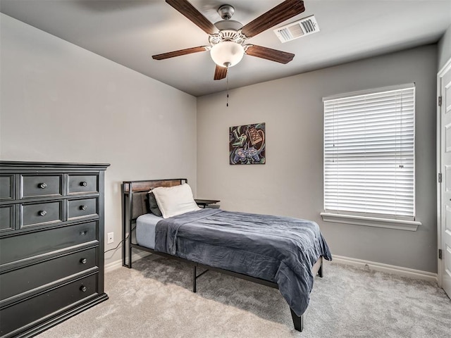 10824 NW 32nd Ter, Yukon, OK 73099 - bedroom with light colored carpet and a ceiling fan