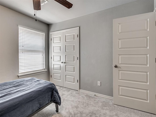 10824 NW 32nd Ter, Yukon, OK 73099 - bedroom featuring carpet flooring, a closet, and a ceiling fan