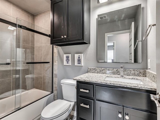 10824 NW 32nd Ter, Yukon, OK 73099 - bathroom with vanity and combined bath / shower with glass door