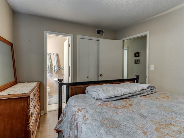 1200 Kingston Dr, Yukon, OK 73099 - bedroom featuring a closet and ensuite bath
