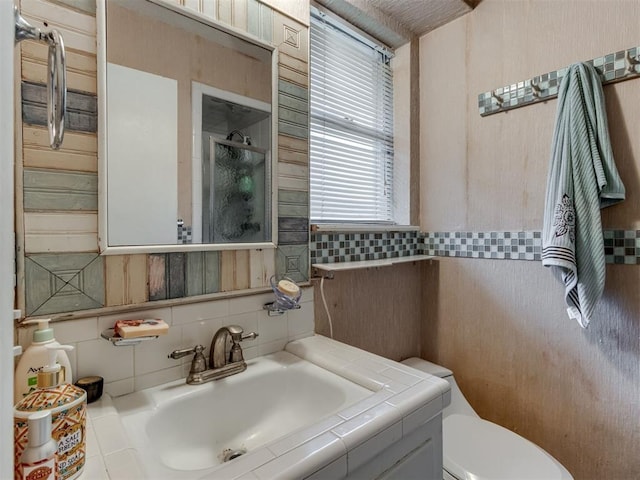 1200 Kingston Dr, Yukon, OK 73099 - full bathroom featuring tile walls, vanity, and a shower with shower door