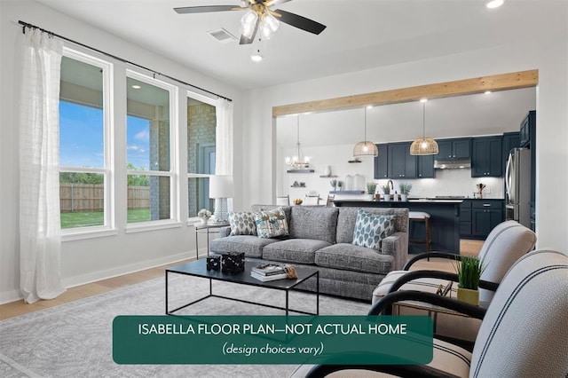 801 Caladium Dr, Yukon, OK 73099 - living area with a ceiling fan, light wood-type flooring, a chandelier, and recessed lighting