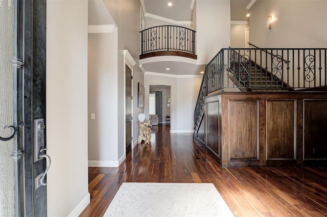 4409 Farm Hill Rd, Norman, OK 73072 - foyer entrance with a towering ceiling, dark wood-style floors, crown molding, stairs, and recessed lighting