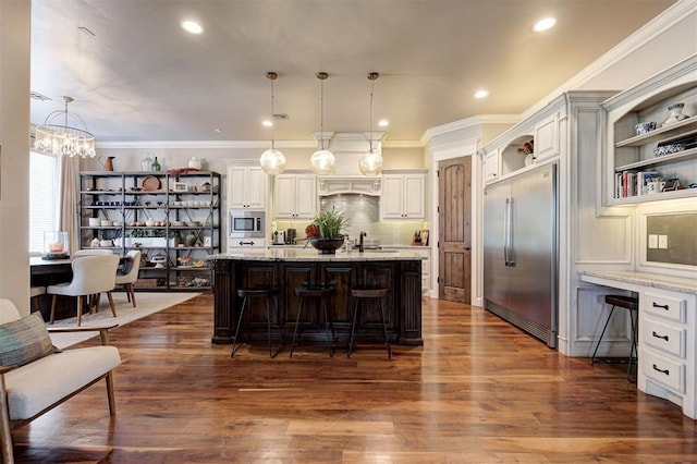 4409 Farm Hill Rd, Norman, OK 73072 - kitchen with built in appliances, open shelves, a kitchen bar, a chandelier, and dark wood finished floors