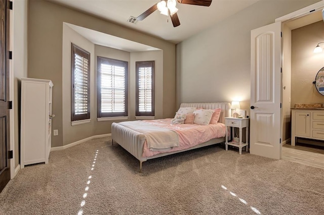 4409 Farm Hill Rd, Norman, OK 73072 - bedroom with light carpet, connected bathroom, and ceiling fan