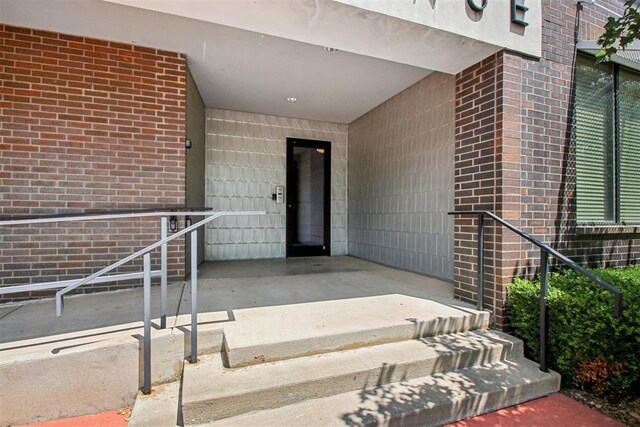 444 N Central Ave Unit 204, Oklahoma City, OK 73104 - property entrance featuring brick siding