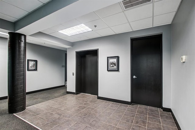 444 N Central Ave Unit 204, Oklahoma City, OK 73104 - tiled empty room featuring a drop ceiling, elevator, and fire sprinkler in ceiling