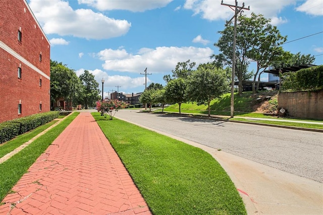 444 N Central Ave Unit 204, Oklahoma City, OK 73104 - view of asphalt street featuring sidewalks, curbs, and street lights