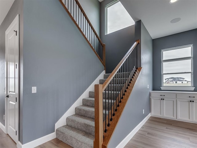 7431 NE Hawk Dr, Piedmont, OK 73078 - stairs with wood finished floors and recessed lighting
