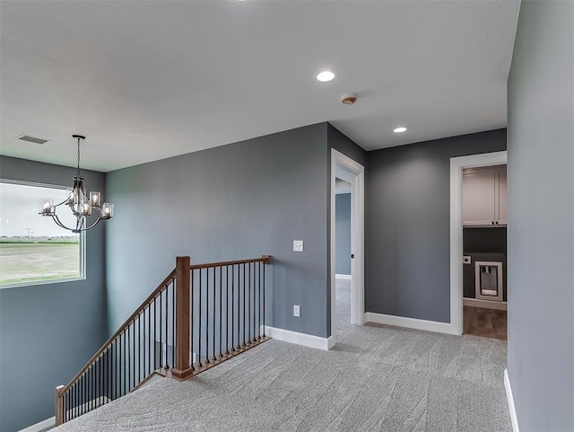 7431 NE Hawk Dr, Piedmont, OK 73078 - corridor with an upstairs landing, a chandelier, carpet, and recessed lighting