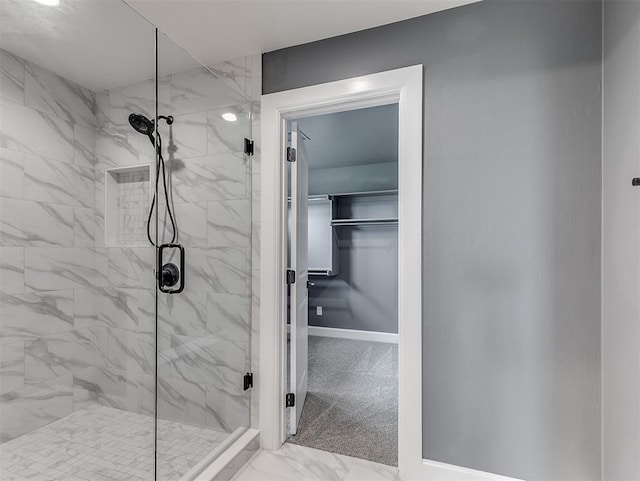 7431 NE Hawk Dr, Piedmont, OK 73078 - bathroom with a marble finish shower and marble finish floors