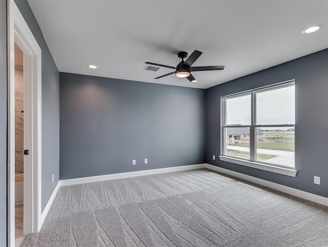 7431 NE Hawk Dr, Piedmont, OK 73078 - carpeted spare room with a ceiling fan and recessed lighting