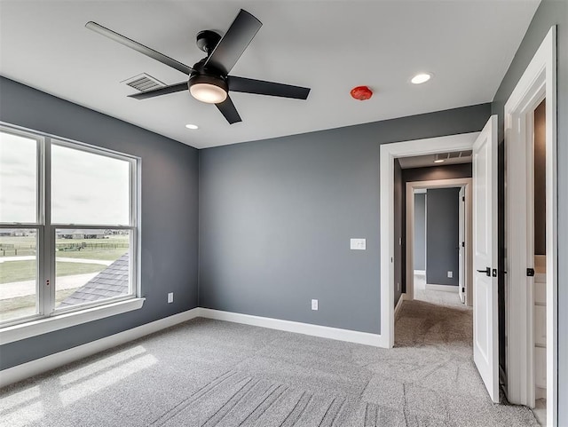 7431 NE Hawk Dr, Piedmont, OK 73078 - unfurnished room with light colored carpet, a ceiling fan, and recessed lighting