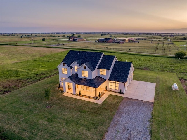7431 NE Hawk Dr, Piedmont, OK 73078 - aerial view at dusk of a view of countryside