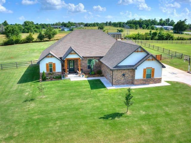2315 Dixie Dr, Blanchard, OK 73010 - view of front facade with stone siding and a view of countryside