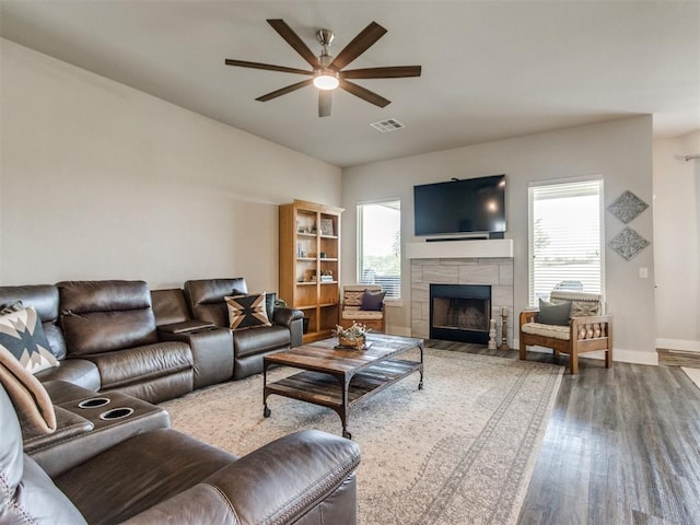 2315 Dixie Dr, Blanchard, OK 73010 - living room featuring a ceiling fan, wood finished floors, and a tile fireplace