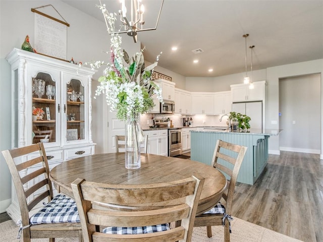 2315 Dixie Dr, Blanchard, OK 73010 - dining area with a chandelier, light wood-style flooring, and recessed lighting