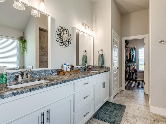 2315 Dixie Dr, Blanchard, OK 73010 - full bath with double vanity, tile patterned flooring, and a walk in closet
