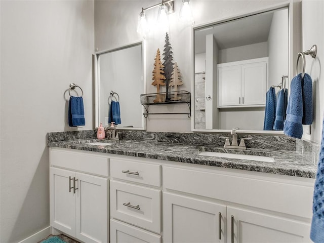 2315 Dixie Dr, Blanchard, OK 73010 - bathroom featuring double vanity and baseboards