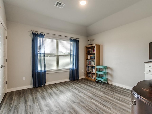 2315 Dixie Dr, Blanchard, OK 73010 - living area featuring wood finished floors and lofted ceiling