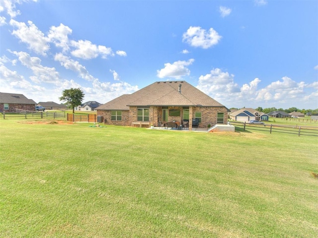 2315 Dixie Dr, Blanchard, OK 73010 - back of house with a patio area and brick siding