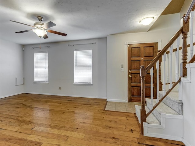 1800 Michael Dr, Edmond, OK 73013 - entryway featuring stairs, light wood-type flooring, and a ceiling fan