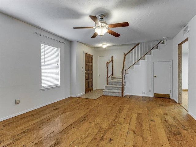 1800 Michael Dr, Edmond, OK 73013 - foyer entrance with stairway, light wood finished floors, and ceiling fan