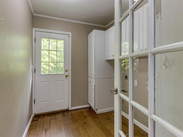 1800 Michael Dr, Edmond, OK 73013 - doorway featuring wood finished floors and ornamental molding