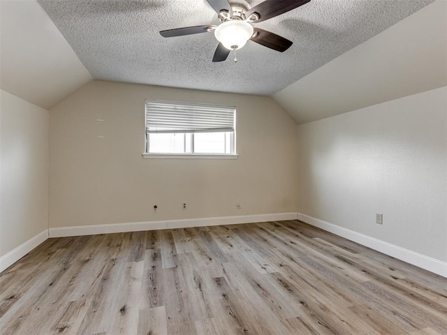 1800 Michael Dr, Edmond, OK 73013 - bonus room with vaulted ceiling, a textured ceiling, wood finished floors, and ceiling fan