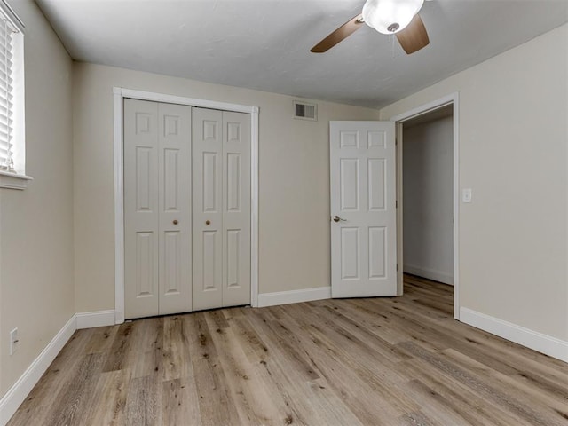 1800 Michael Dr, Edmond, OK 73013 - unfurnished bedroom featuring wood finished floors, a closet, and ceiling fan