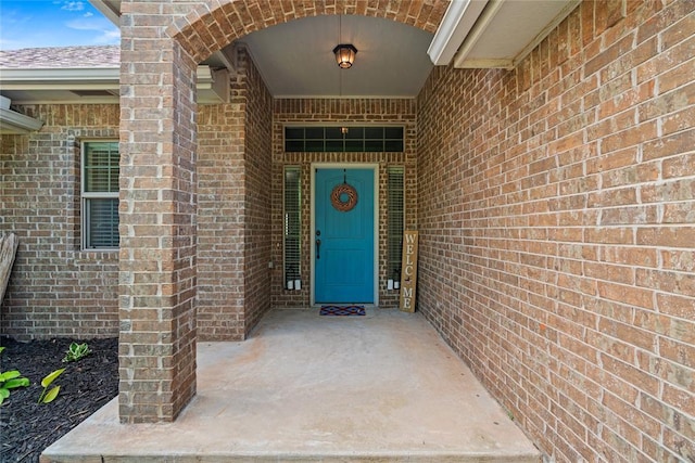 7324 Ridge Manor Ln, Oklahoma City, OK 73150 - doorway to property featuring brick siding