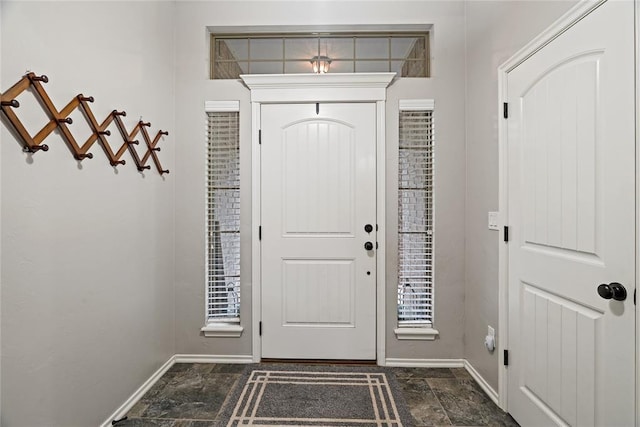 7324 Ridge Manor Ln, Oklahoma City, OK 73150 - entryway featuring dark stone finish flooring and baseboards