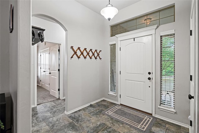 7324 Ridge Manor Ln, Oklahoma City, OK 73150 - foyer entrance with stone finish flooring and arched walkways