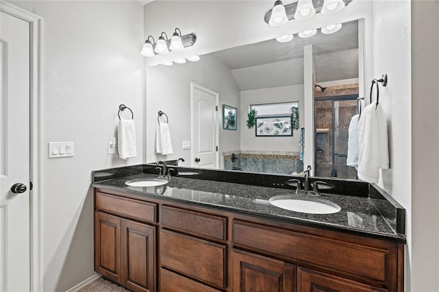 7324 Ridge Manor Ln, Oklahoma City, OK 73150 - full bathroom with double vanity, a shower stall, and vaulted ceiling