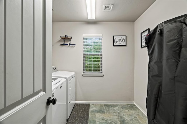 7324 Ridge Manor Ln, Oklahoma City, OK 73150 - laundry area with independent washer and dryer and stone finish floors