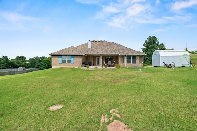 7324 Ridge Manor Ln, Oklahoma City, OK 73150 - rear view of property featuring an outbuilding and a patio area