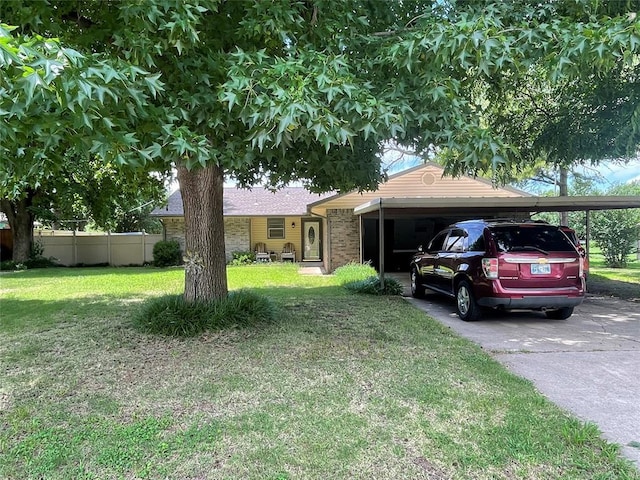 single story home with a carport and asphalt driveway